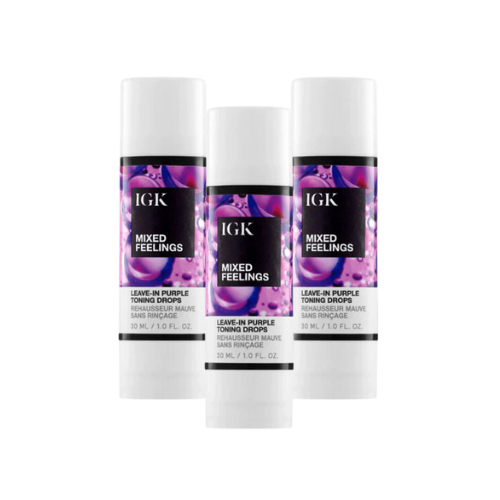 Three bottles of IGK Mixed Feelings Leave-In Purple Toning Drops.