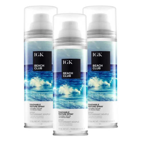 Three bottles of IGK Beach Club Texture Spray.