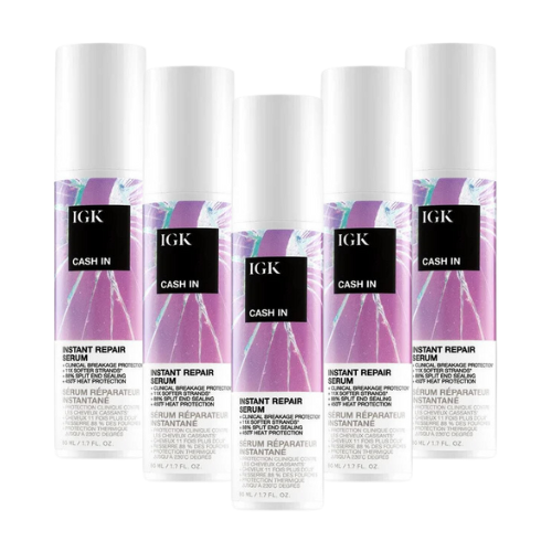 Five bottles of IGK Cash In Instant Repair Serum with purple branding.