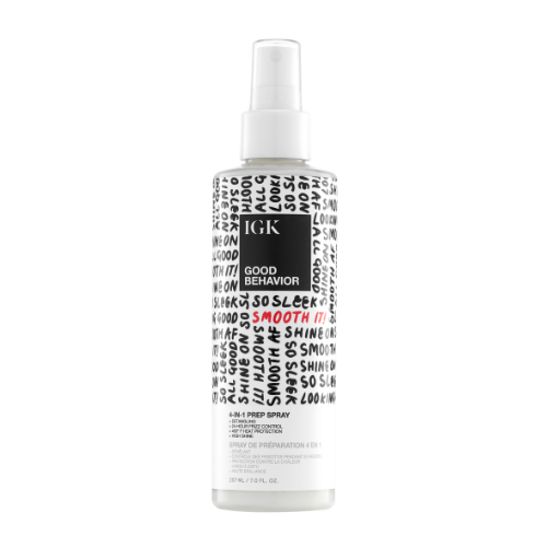 Bottle of IGK Good Behavior 4-in-1 Prep Spray with black and white text design.
