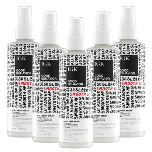 Five bottles of IGK Good Behavior 4-in-1 Prep Spray arranged in a row.
