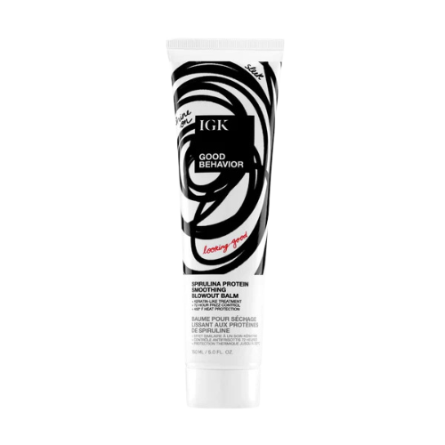 IGK Good Behavior Smoothing Blowout Balm tube with black and white abstract patterns.