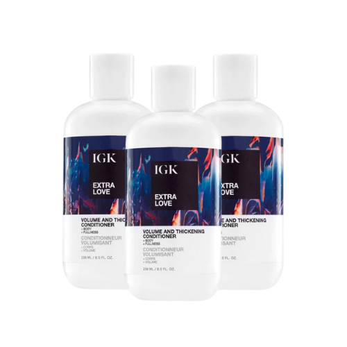 Three bottles of IGK Extra Love Volume and Thickening Conditioner.