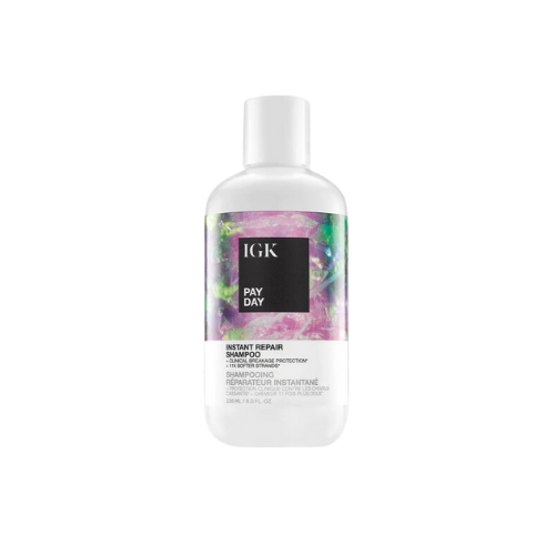Bottle of IGK Pay Day Instant Repair Shampoo with a colorful label.